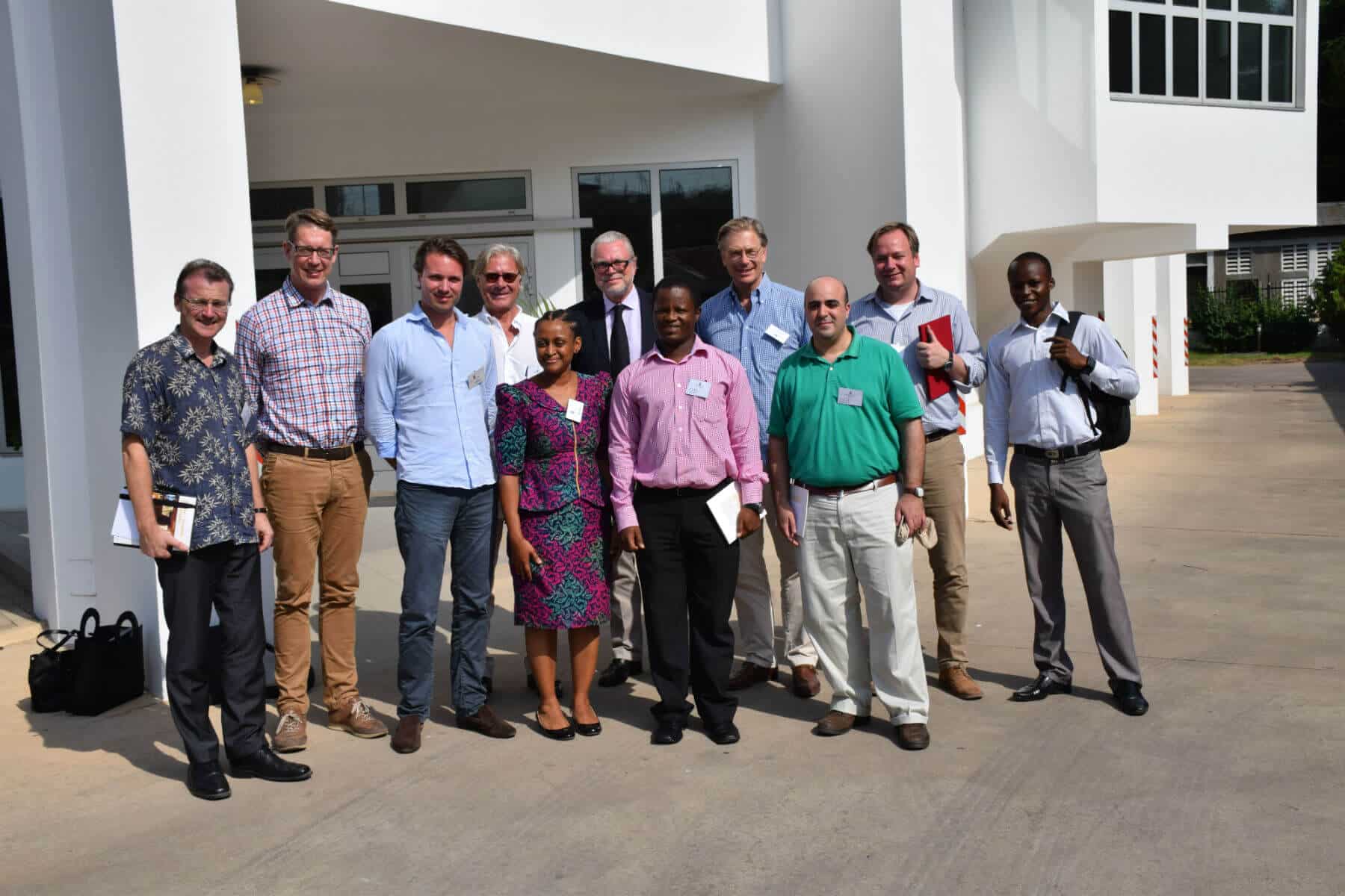 MTI investment team standing closely together with African investors