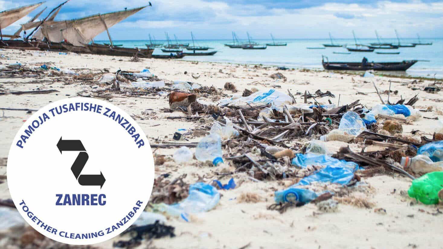 Beach full oh trash with the Zanrec logo that promote to clean together Zanzibar