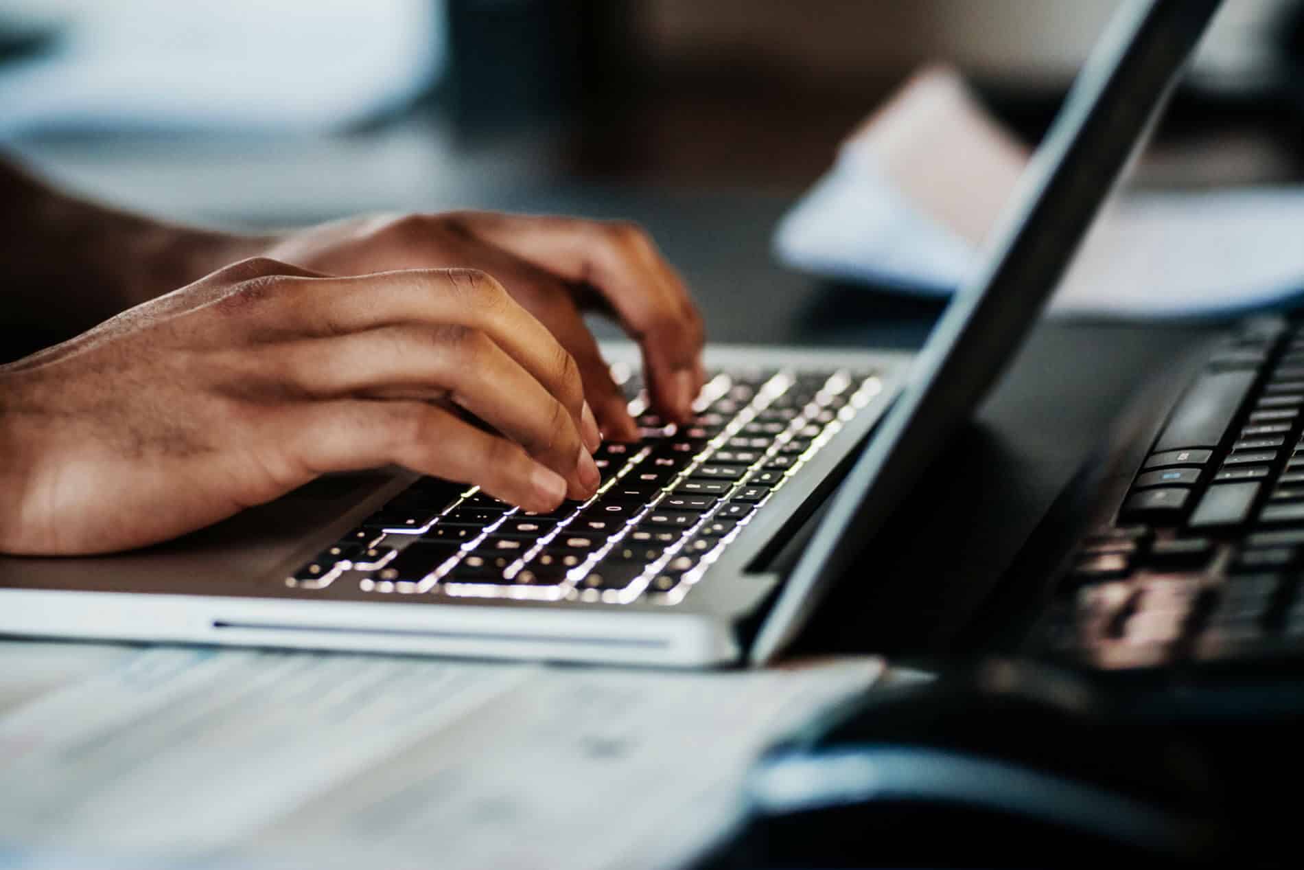 A worker typing on his keyboard