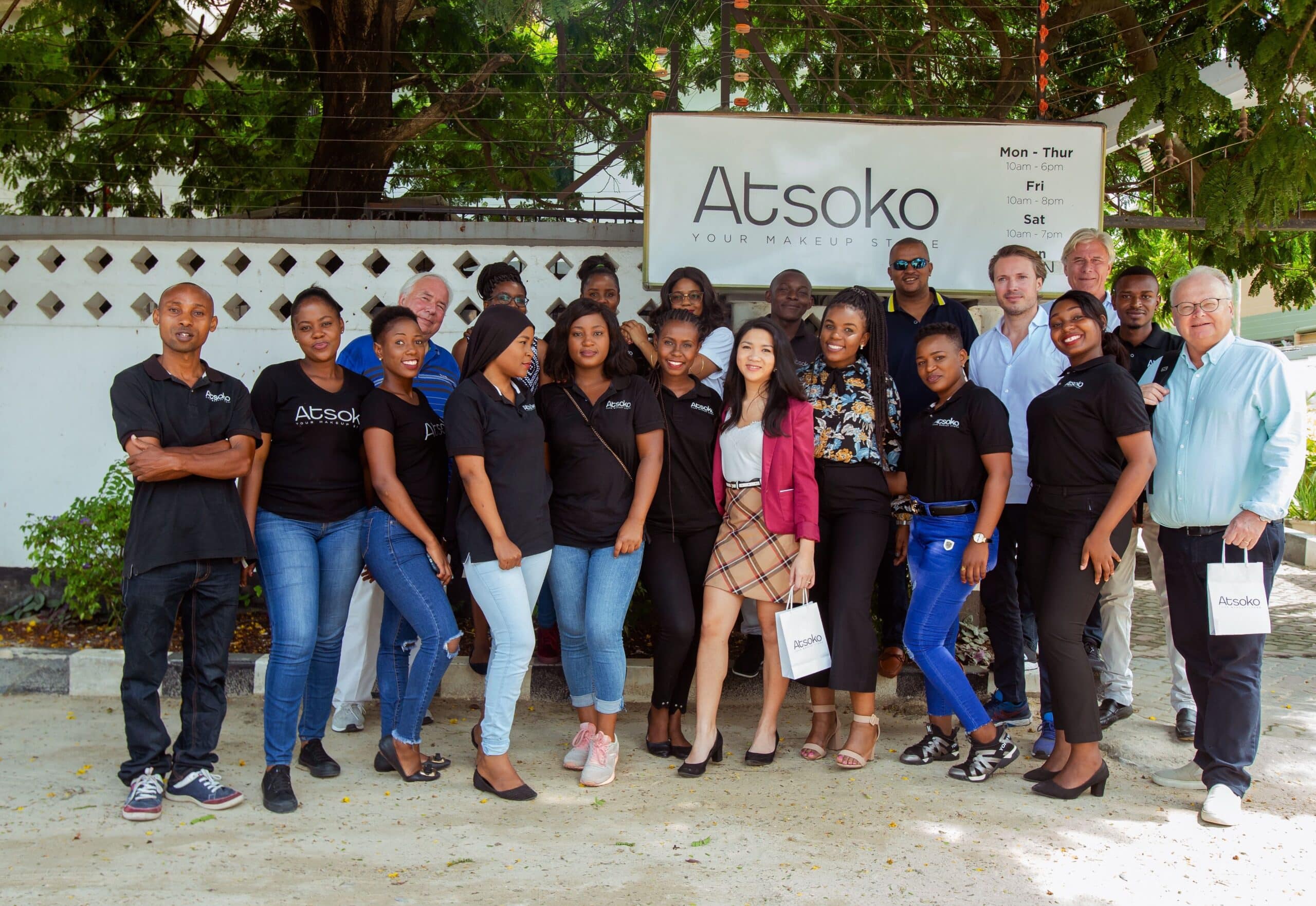 MTI investment team, along with Atsoko makeup store , posing in front of the store