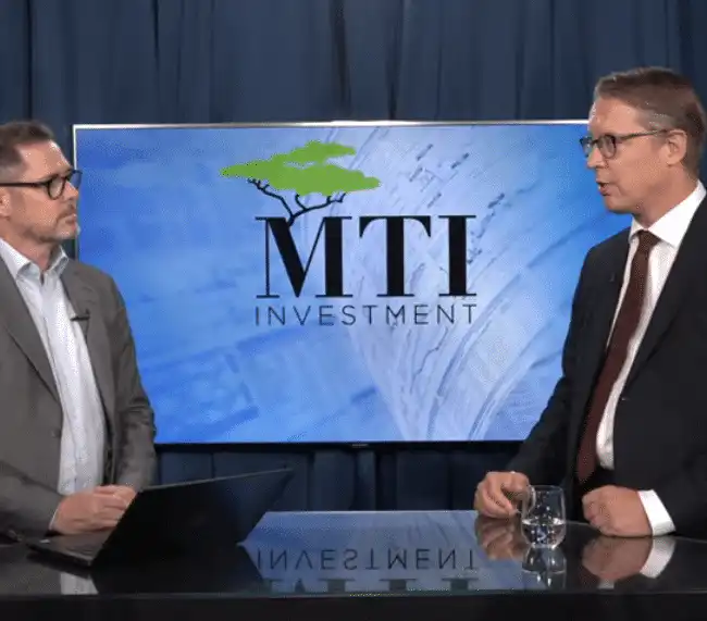The managing director of MTI Investment presenting the company to a TV presenter