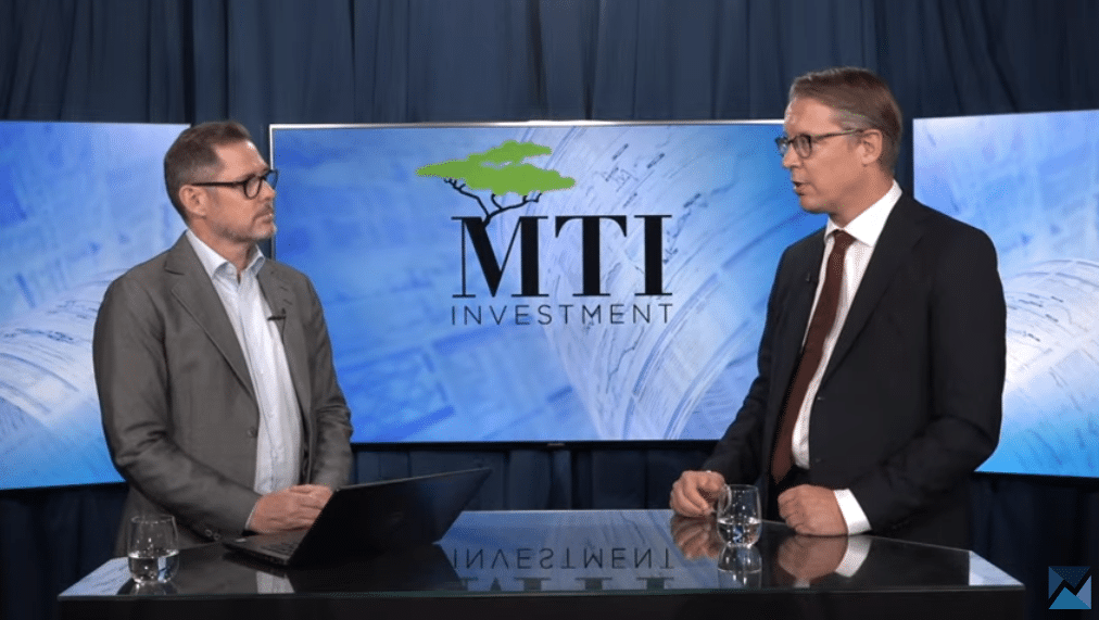 The managing director of MTI Investment presenting the company to a TV presenter
