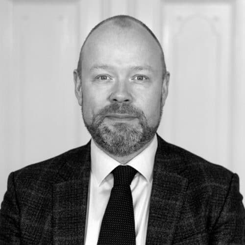A black & white picture of Martin Rex Empacher a consultant at MTI Investment