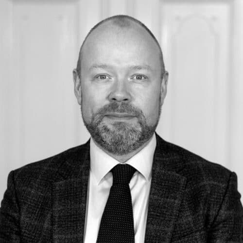 A black & white picture of Martin Rex Empacher a consultant at MTI Investment