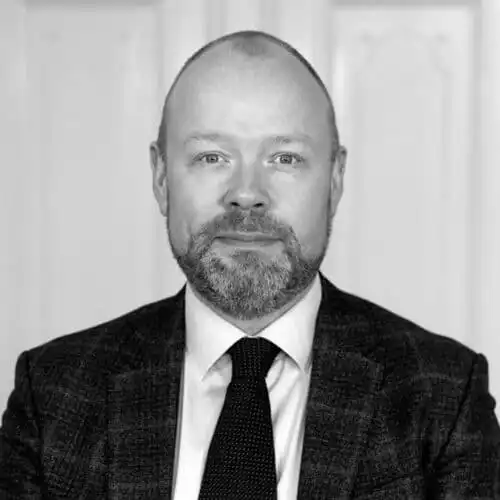 A black & white picture of Martin Rex Empacher a consultant at MTI Investment
